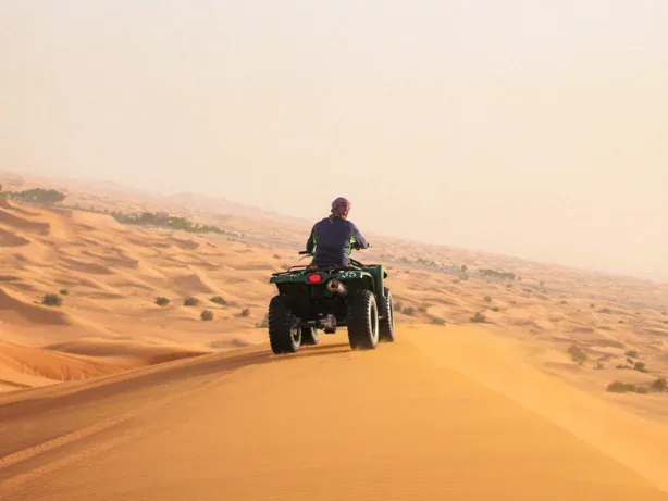 Rider on a red quad bike on the Jaisalmer dunes